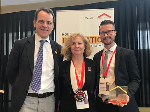 CMHC President and CEO Evan Siddal, and representatives for the President's Medal winner and Housing Research Excellence winner.