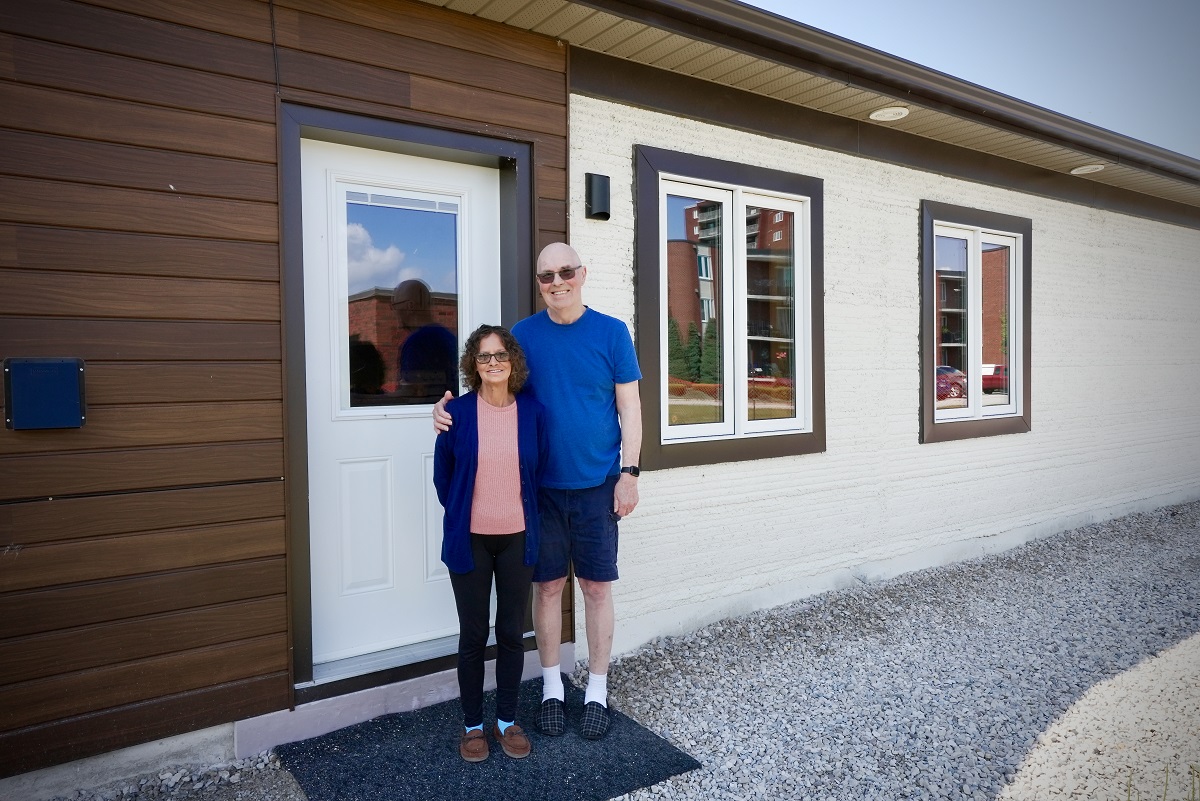 Tammy and Lou Malott outside their 3D printed home in Leamington.