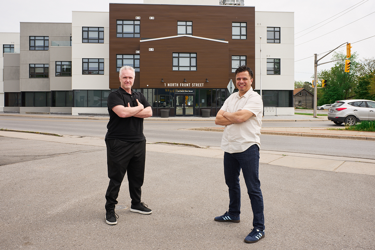 Rick Summers and Frank Horn outside Sagonaska Place, a former office building that has been transformed into a 38-unit housing development in Belleville.