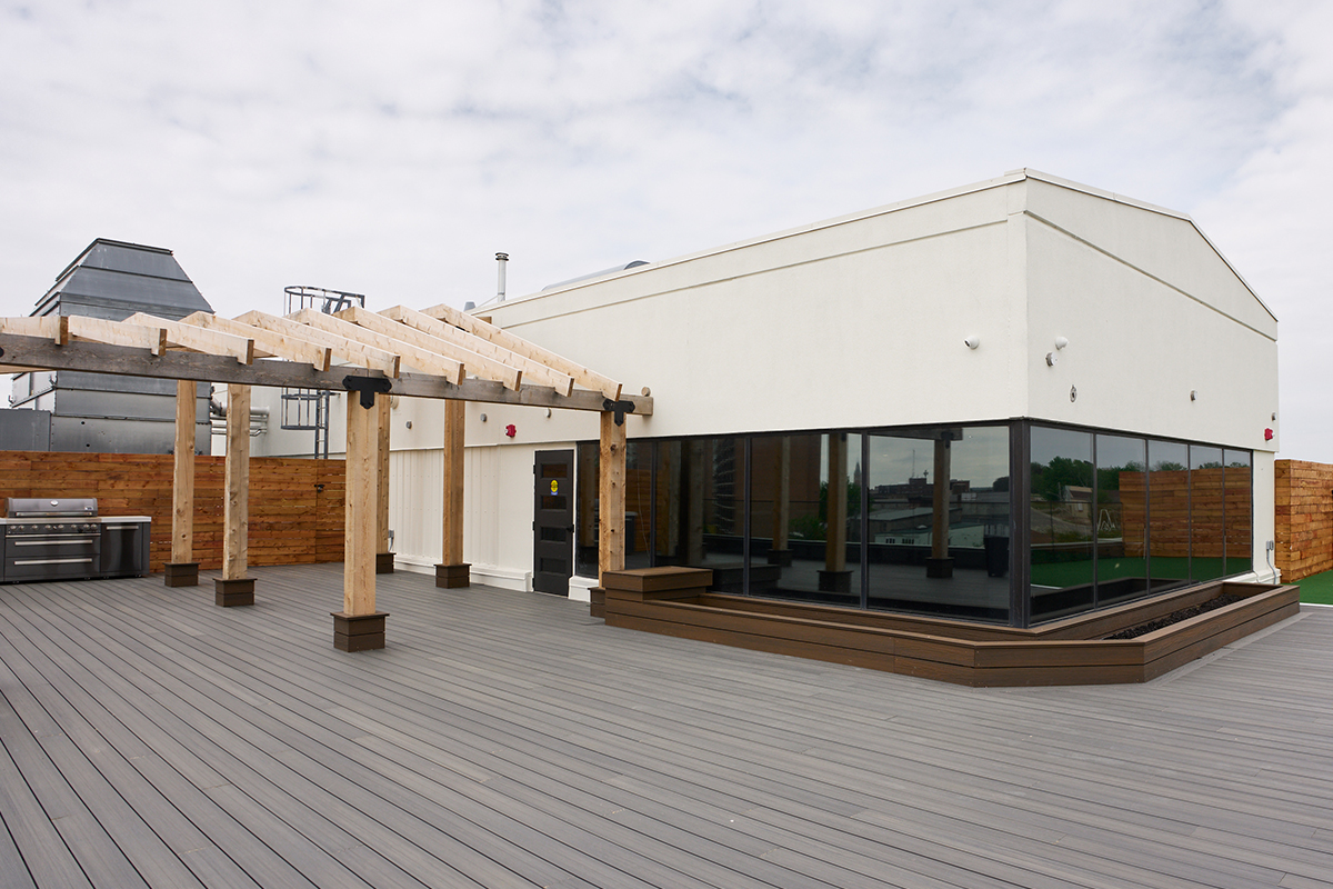 The 38-unit building includes a rooftop patio with barbecue facilities and a putting green.