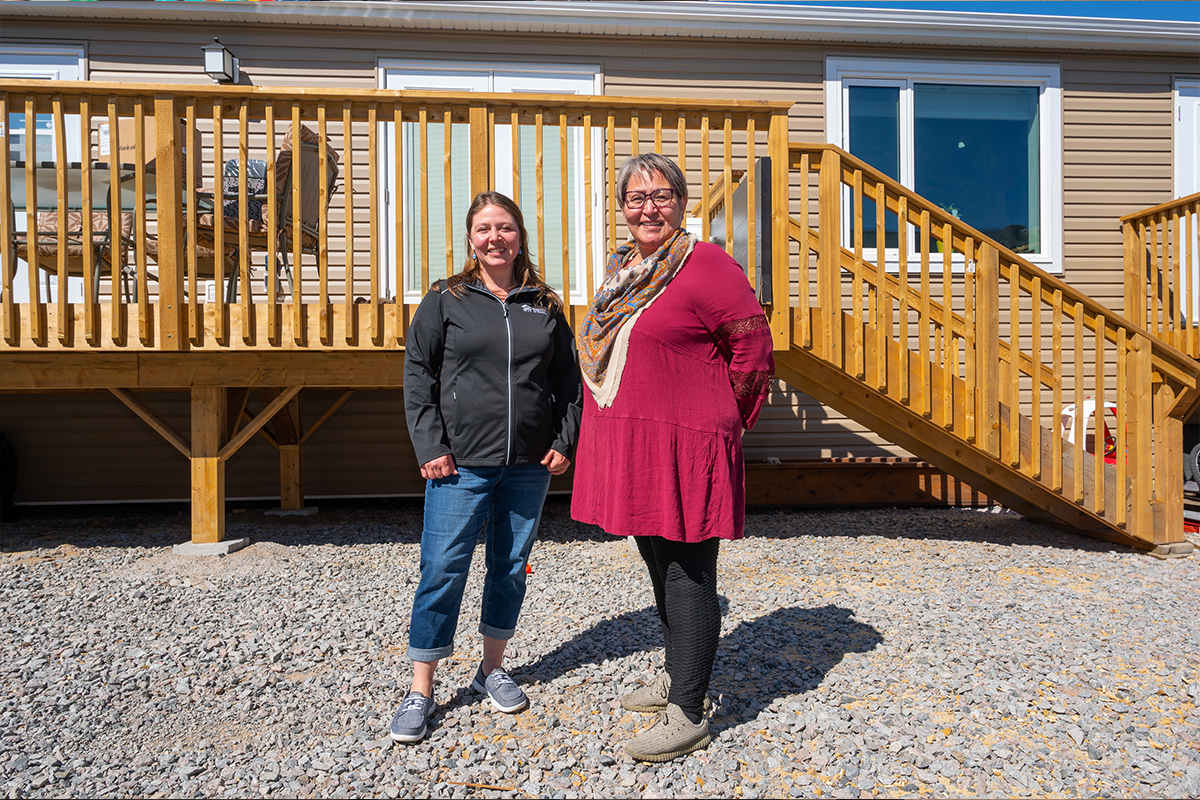 Alayna Ward, executive director, Habitat for Humanity NWT and Habitat homeowner, Susanna Qitsualik outside Susanna’s new home in Yellowknife.